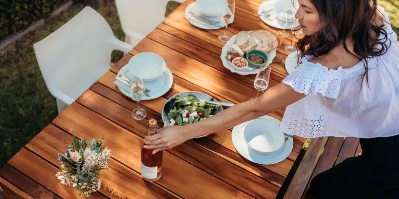 lady setting outside table