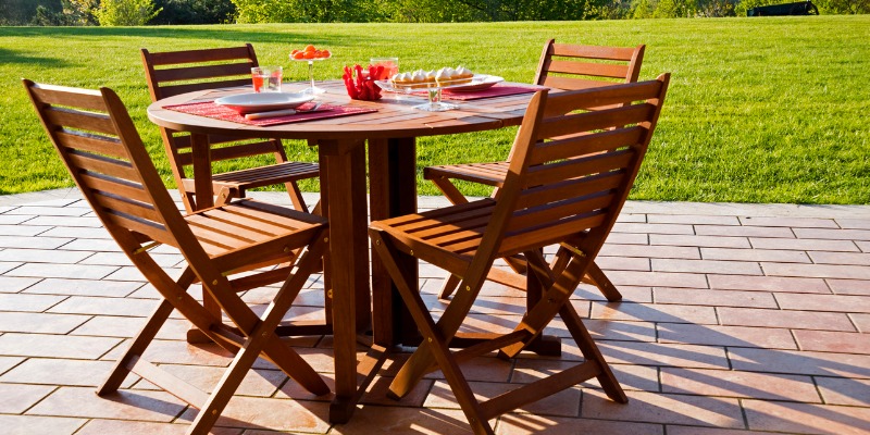 Wooden patio set in backyard